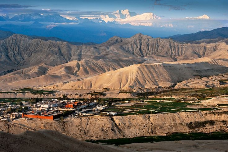 Arid cliffs and eroded terrain of the upper Kali Gandaki valley in Mustang
