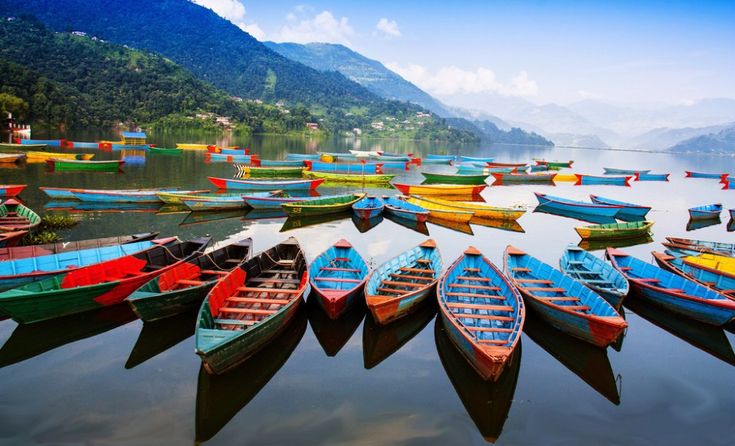 Phewa Lake in the Pokhara valley with forested hills behind